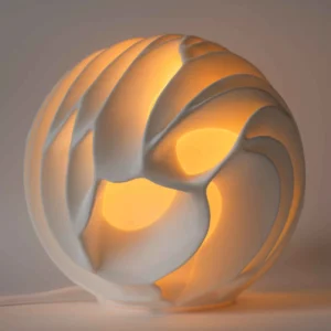 face.webp Maxi lampe Lava XL au design fluide et organique, allumée.