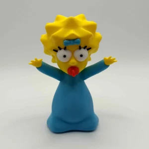 Vue de face de la figurine Maggie Simpson en impression 3D avec sa tétine bleue.