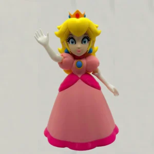 Vue de face de la figurine Princesse Peach en impression 3D avec sa robe iconique.