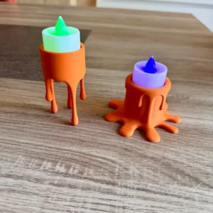 Duo de bougeoirs originaux orange effet cire qui coule avec bougies chauffe-plat LED allumées