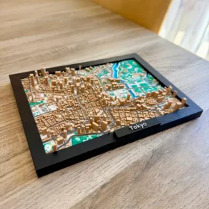 Vue en perspective rapprochée mettant en valeur le relief topographique et les gratte-ciels en impression 3D de la carte de Tokyo